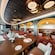 Tables, chairs, and table settings in Palo Steakhouse on board the Disney Wish cruise ship